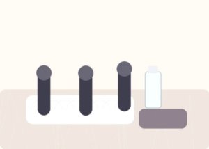Curved vibrators and lubricant arranged on soft bedding to compare blended, clitoral, and G-spot stimulation paths.