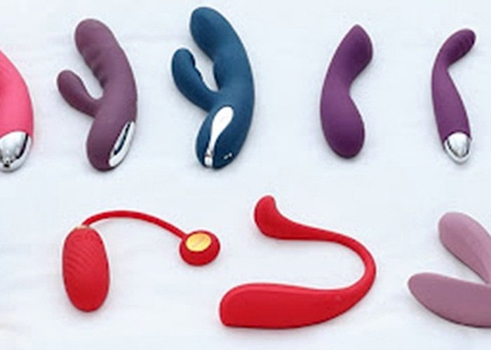 A small group of anal-safe toys laid beside a towel to compare seated comfort, base width, and removal control.