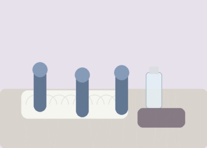 A realistic vibrator setup on a towel for comparing charging, storage, and how shaped heads affect control.