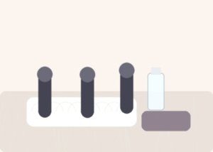 Several curved vibrators arranged on soft bedding to compare shape, width, and reach for G-spot targeting.
