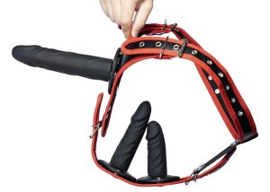 A black strap-on dildo and harness product shown close up for a beginner setup guide.