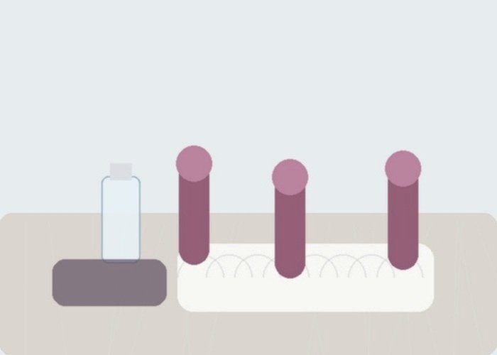 A compact vibrator beside a phone stand and charger arranged to compare quiet modes, signal checks, and battery timing.