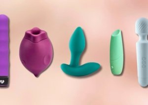 Several vibrator styles arranged on soft bedding for a practical comparison of bullet, wand, rabbit, suction, and wearable options.