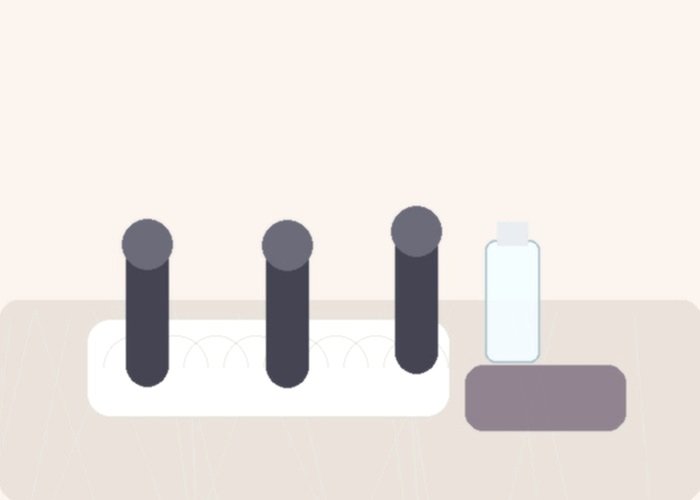 Several curved vibrators arranged on soft bedding to compare shape, width, and reach for G-spot targeting.